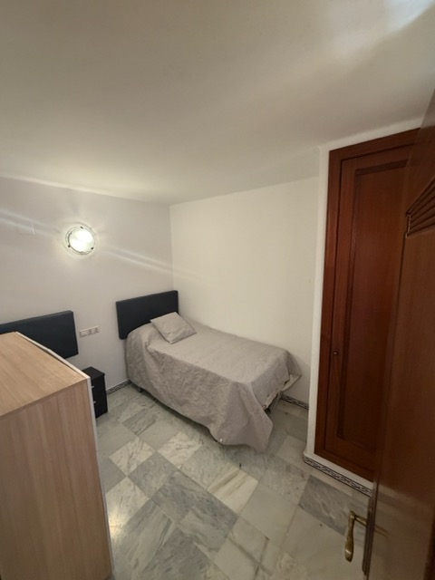Second bedroom with marble flooring