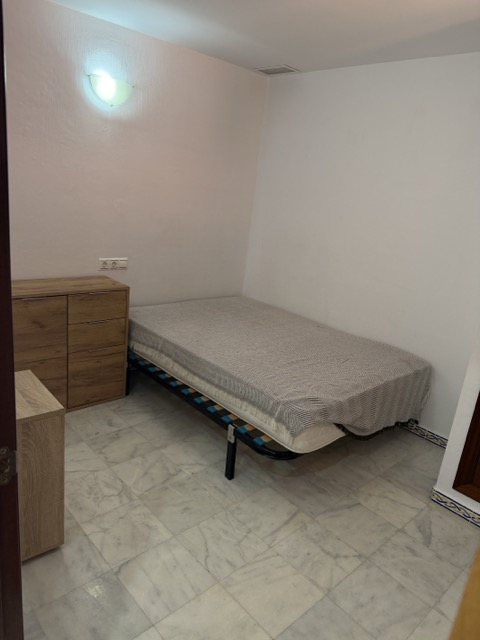 Second bedroom with marble flooring